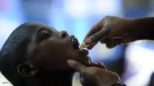 A boy receives the second dose of the vaccine against cholera in Saut d'Eau, in the Central Plateau of Haiti, on 17 September 2014. The UN has launched its second phase of the vaccinationcampaign against cholera which was initiated and implemented by the Haitian authorities as part of the broader framework of the national plan for the elimination of cholera in the country. The campaign aims to vaccinate 200,000 people living in the communes where the disease persists in particular the department of Artibonite, Central and West.  AFP PHOTO/Hector RETAMAL        (Photo credit should read HECTOR RETAMAL/AFP/Getty Images)