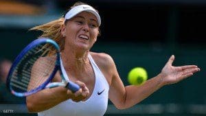 Russia's Maria Sharapova returns against US player Coco Vandeweghe during their women's quarter-finals match on day eight of the 2015 Wimbledon Championships at The All England Tennis Club in Wimbledon, southwest London, on July 7, 2015.  Sharapova won the match 6-3, 6-7, 6-2.  RESTRICTED TO EDITORIAL USE  -- AFP PHOTO / GLYN KIRK        (Photo credit should read GLYN KIRK/AFP/Getty Images)